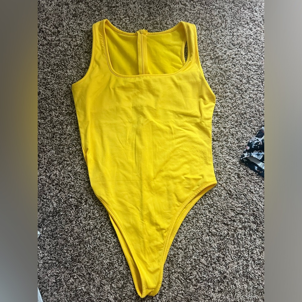 Yellow body suit